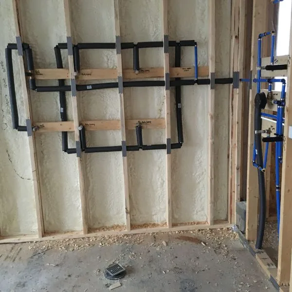 New pipe installed in wall cavity