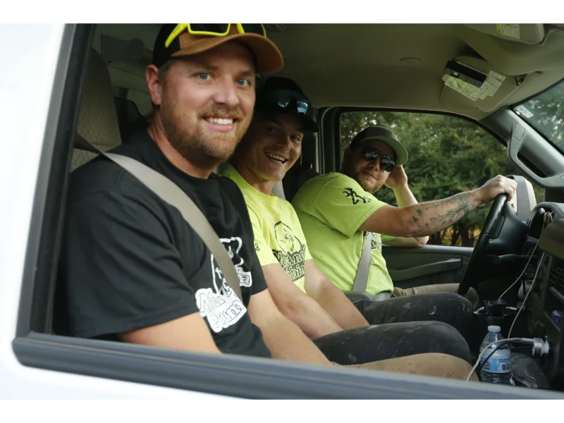 Plumbers sitting in a truck